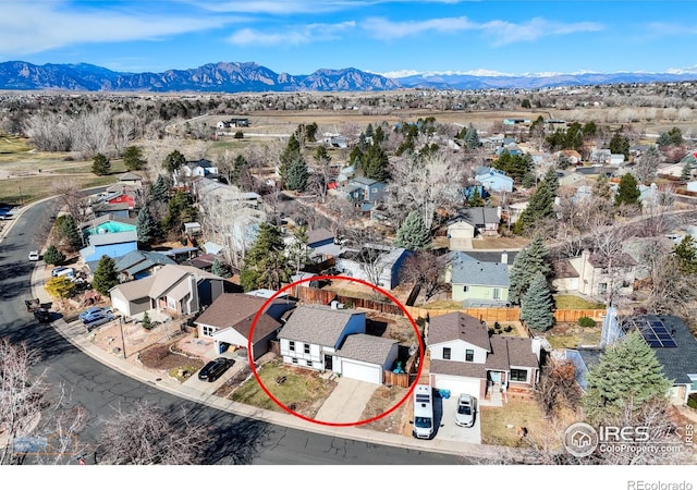 birds eye view of property featuring a mountain view and a residential view