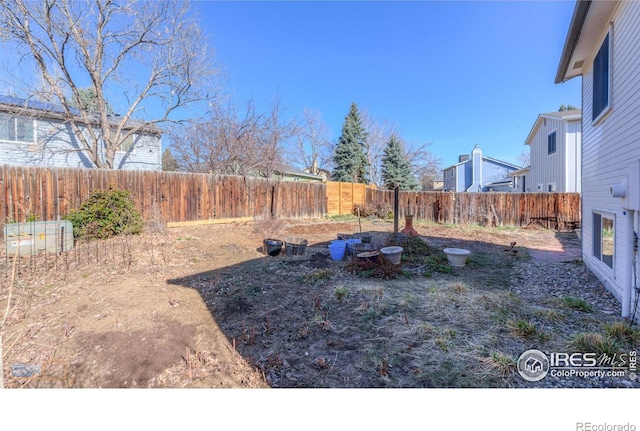 view of yard with a fenced backyard