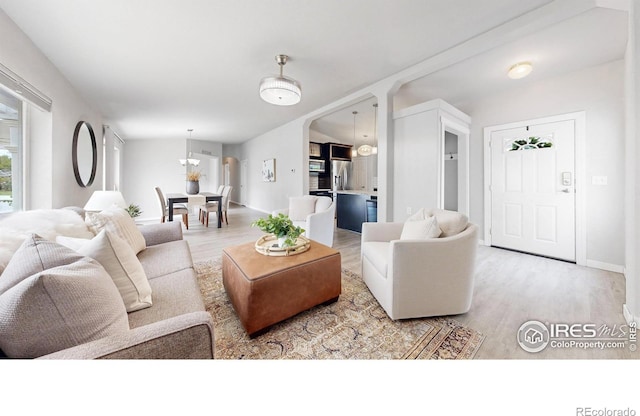 living area featuring wood finished floors and baseboards