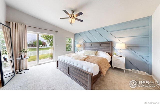 bedroom with visible vents, ceiling fan, carpet, vaulted ceiling, and access to outside