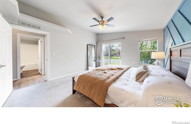 carpeted bedroom with visible vents, baseboards, ceiling fan, and access to outside