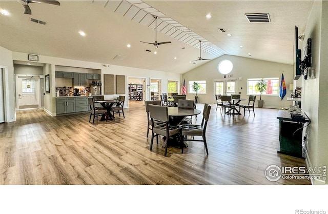 dining area with wood finished floors, visible vents, and ceiling fan