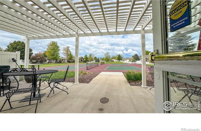 view of patio featuring community basketball court and a pergola