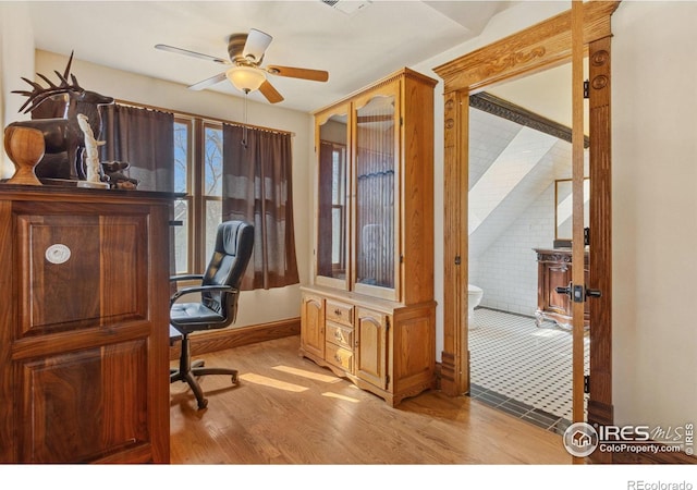 office area featuring visible vents, a ceiling fan, and light wood-type flooring