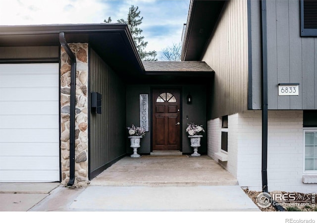 property entrance featuring brick siding