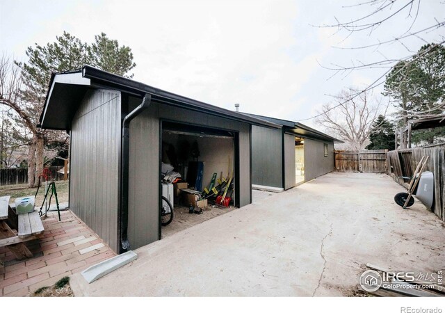 garage with fence