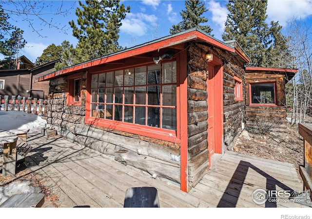 view of side of property featuring stone siding