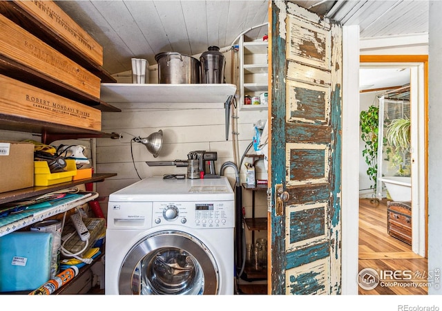 laundry room with wood finished floors, washer / clothes dryer, wood ceiling, and laundry area