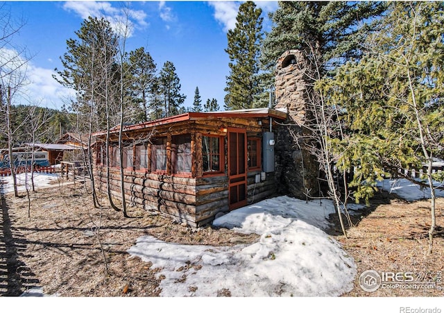 view of property exterior featuring an outbuilding