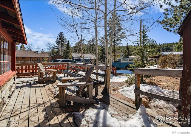 view of snow covered deck