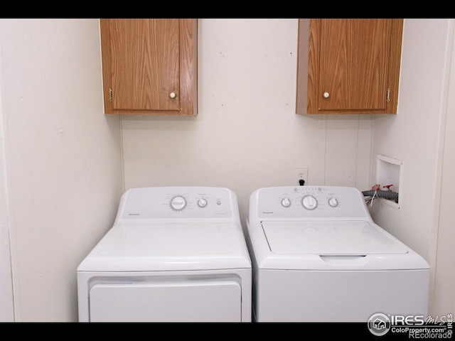 laundry area featuring cabinet space and independent washer and dryer