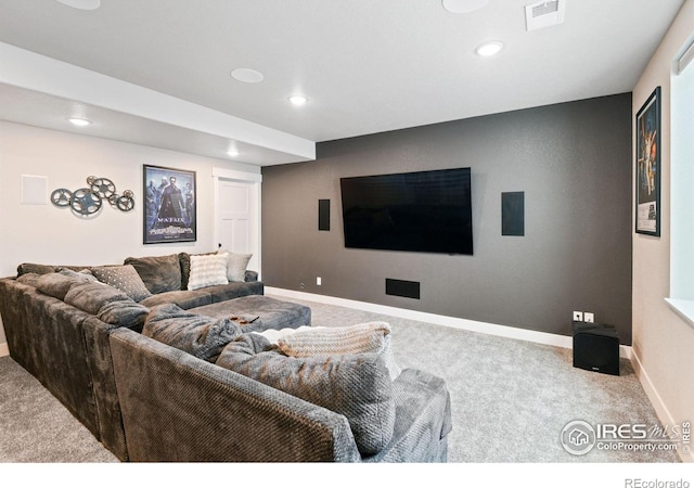 carpeted living area with visible vents, recessed lighting, and baseboards