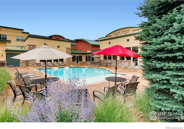 pool featuring a patio area