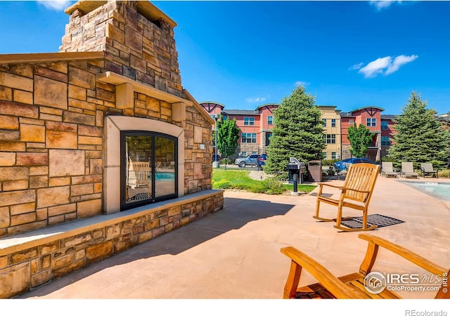 view of patio featuring a community pool