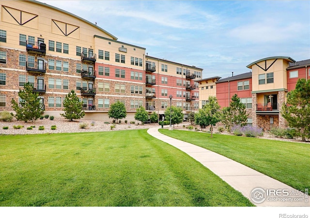 view of home's community with a lawn