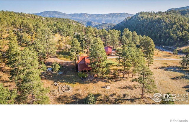 property view of mountains with a forest view