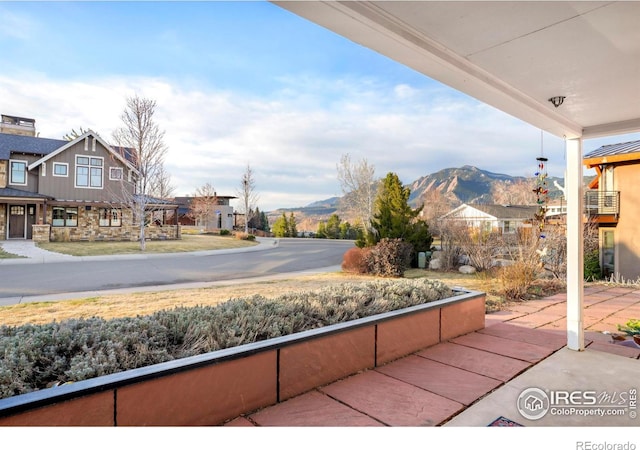 view of patio / terrace with a mountain view