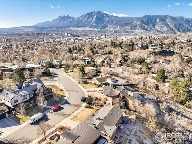 drone / aerial view featuring a residential view and a mountain view