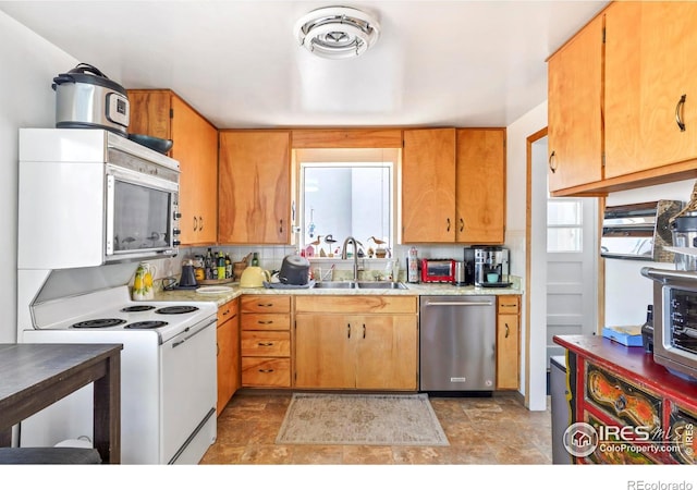 kitchen with visible vents, white range with electric cooktop, dishwasher, light countertops, and a sink