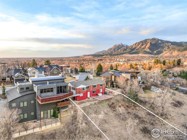 drone / aerial view featuring a residential view and a mountain view