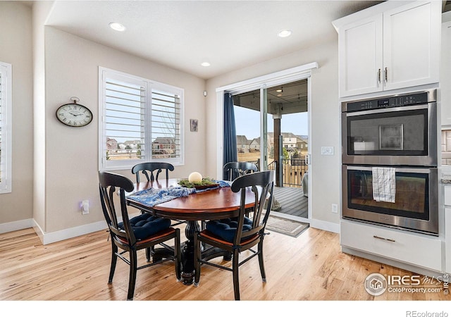 dining room featuring recessed lighting, light wood-type flooring, and baseboards