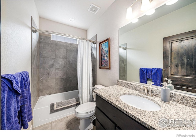 full bathroom with tile patterned flooring, visible vents, toilet, shower / bath combo, and vanity