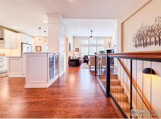 hallway featuring recessed lighting and dark wood-type flooring