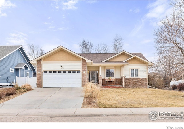 6625 34th St, Greeley, CO 80634 - ranch-style house featuring driveway, an attached garage, covered porch, a shingled roof, and stone siding