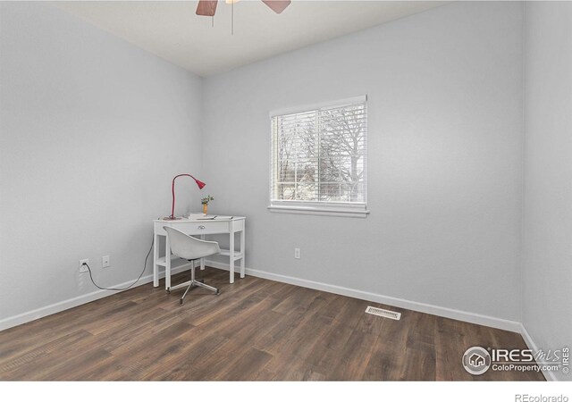 office space with wood finished floors, a ceiling fan, visible vents, and baseboards