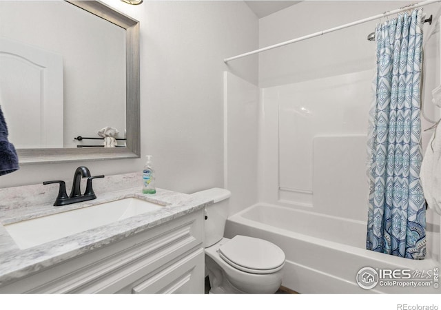 bathroom featuring vanity, toilet, and shower / bathtub combination with curtain