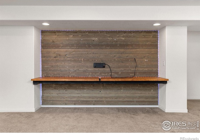 details featuring recessed lighting, wood walls, baseboards, and carpet