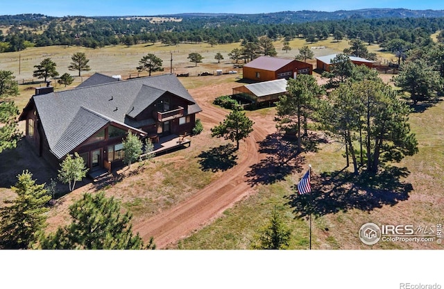 bird's eye view featuring a forest view