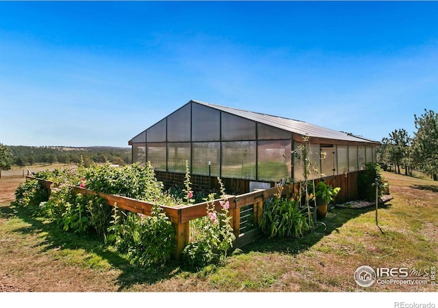 view of yard with an outbuilding and an exterior structure