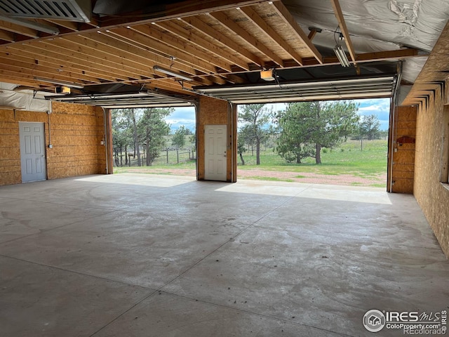 garage with visible vents and a garage door opener