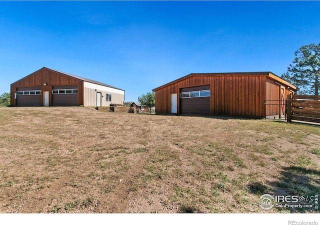 detached garage with fence