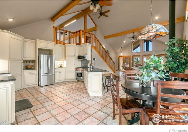 kitchen featuring backsplash, ceiling fan, beamed ceiling, high vaulted ceiling, and stainless steel appliances