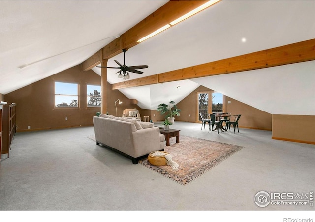 living room with lofted ceiling with beams, carpet, and a ceiling fan