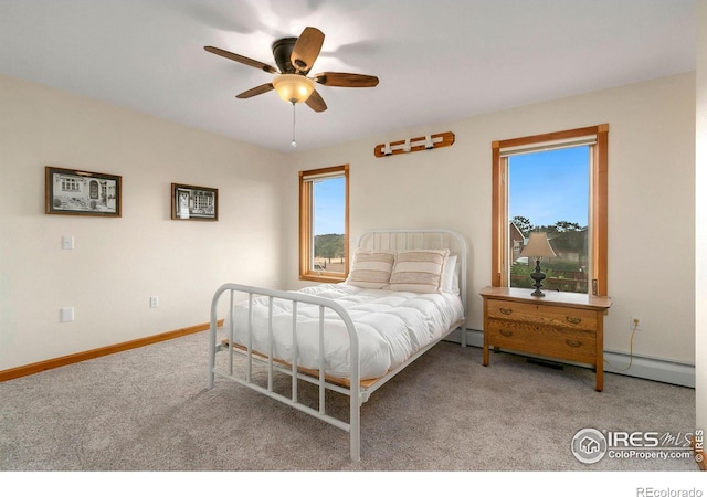 bedroom featuring baseboards, a ceiling fan, and carpet flooring