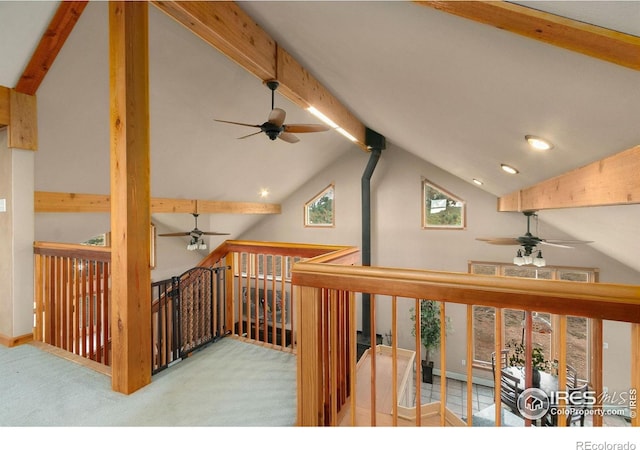 hallway with recessed lighting, beamed ceiling, carpet floors, and high vaulted ceiling