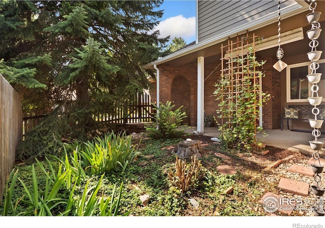 view of yard with a patio and fence