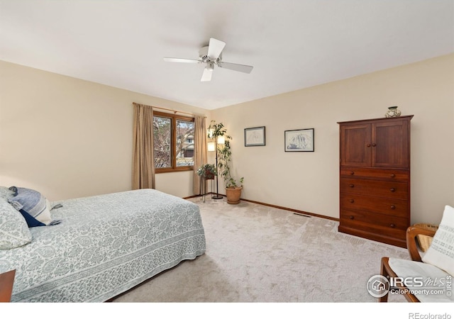 bedroom with baseboards, light colored carpet, and ceiling fan