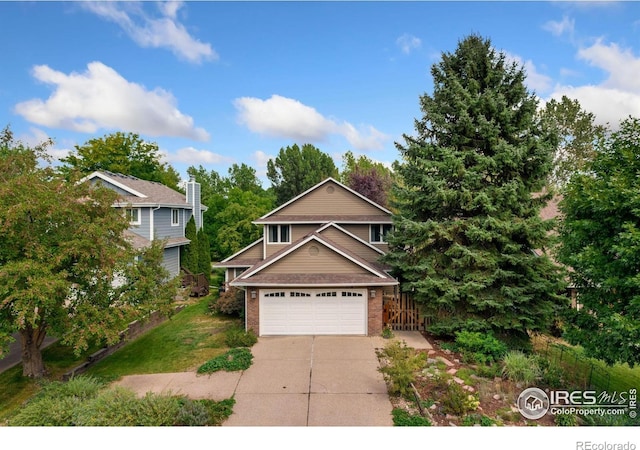 view of front of home featuring brick siding, driveway, and a garage