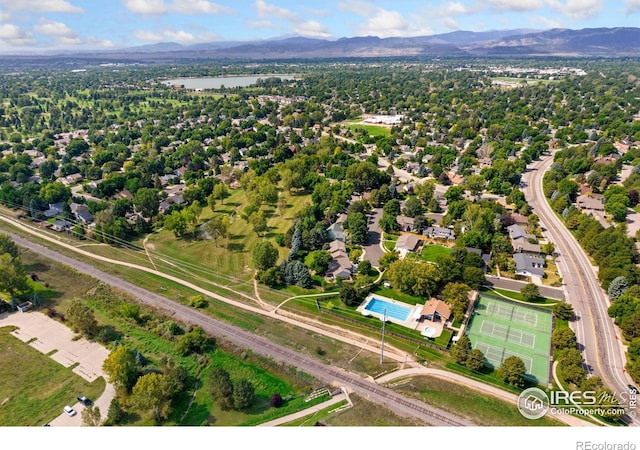 aerial view featuring a water and mountain view