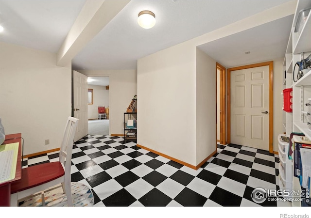 office area with baseboards and light floors