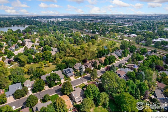 bird's eye view with a residential view and a water view