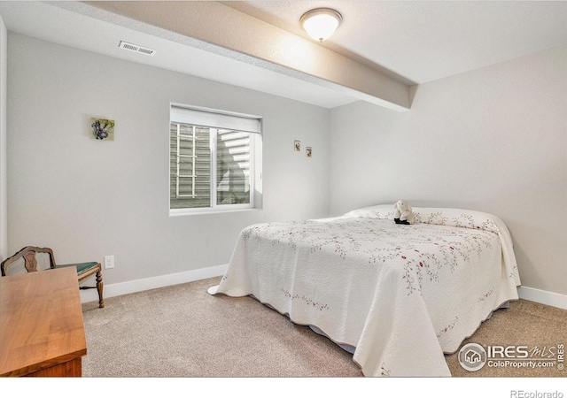 bedroom with beamed ceiling, carpet flooring, baseboards, and visible vents