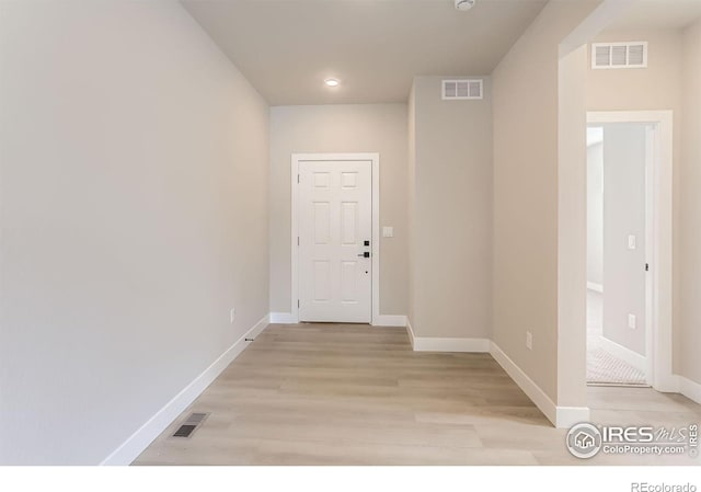 corridor with visible vents and baseboards