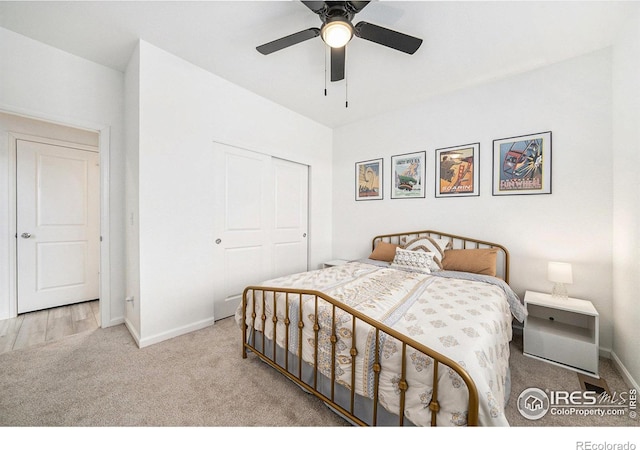 bedroom featuring a closet, baseboards, a ceiling fan, and carpet flooring