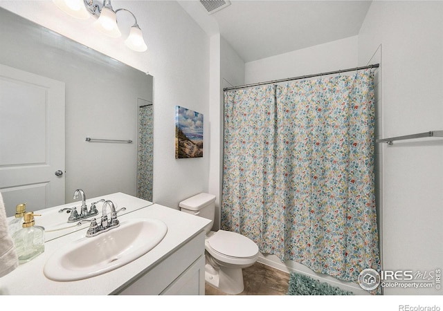 bathroom with visible vents, toilet, vanity, and shower / bath combination with curtain