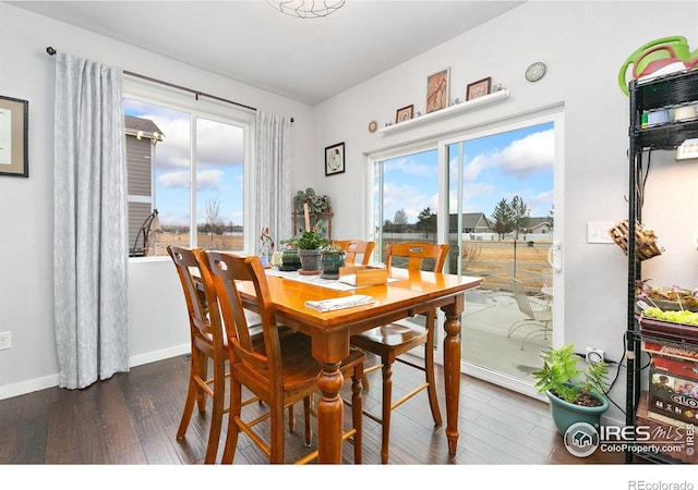 dining area featuring baseboards and wood finished floors